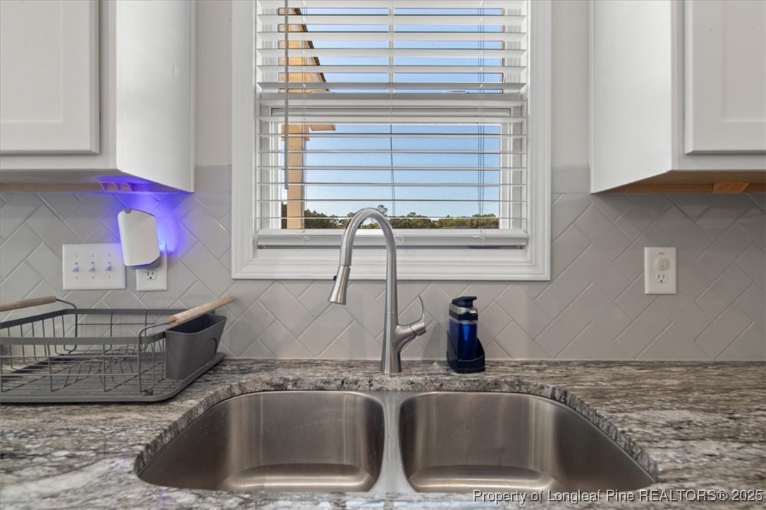 7840 Rufus Johnson Road Fayetteville, NC 28306 - Photo 25 of 50 a kitchen with a sink and a window