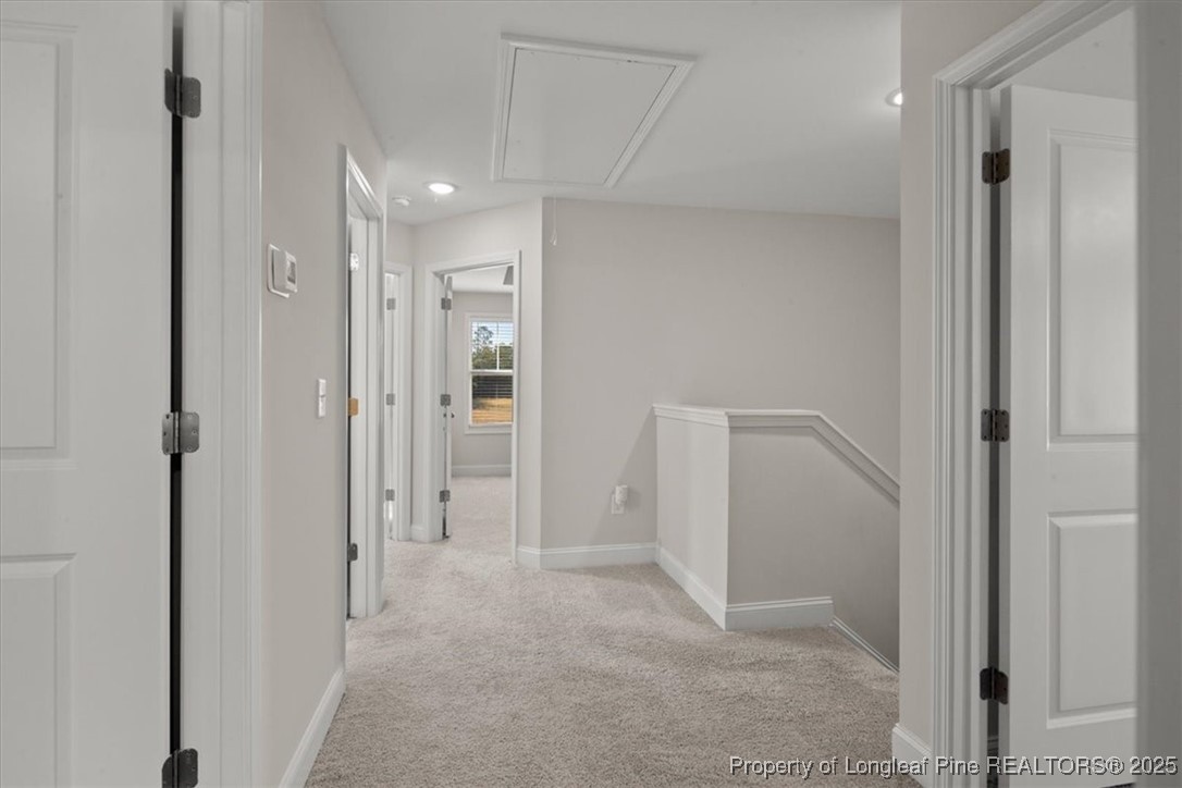 7840 Rufus Johnson Road Fayetteville, NC 28306 - Photo 30 of 50 a view of a hallway with closet and wooden floor