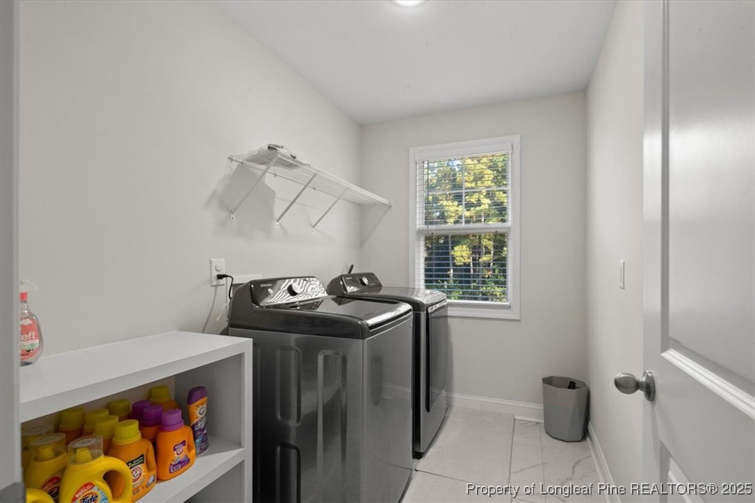 7840 Rufus Johnson Road Fayetteville, NC 28306 - Photo 31 of 50 a utility room with dryer and washer