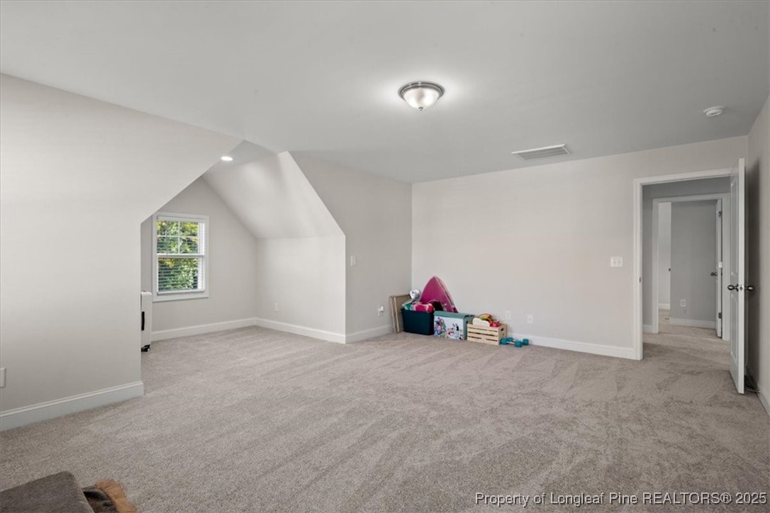 7840 Rufus Johnson Road Fayetteville, NC 28306 - Photo 34 of 50 an empty room with windows and natural light