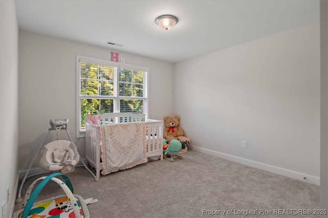 7840 Rufus Johnson Road Fayetteville, NC 28306 - Photo 35 of 50 a room with toys and two window