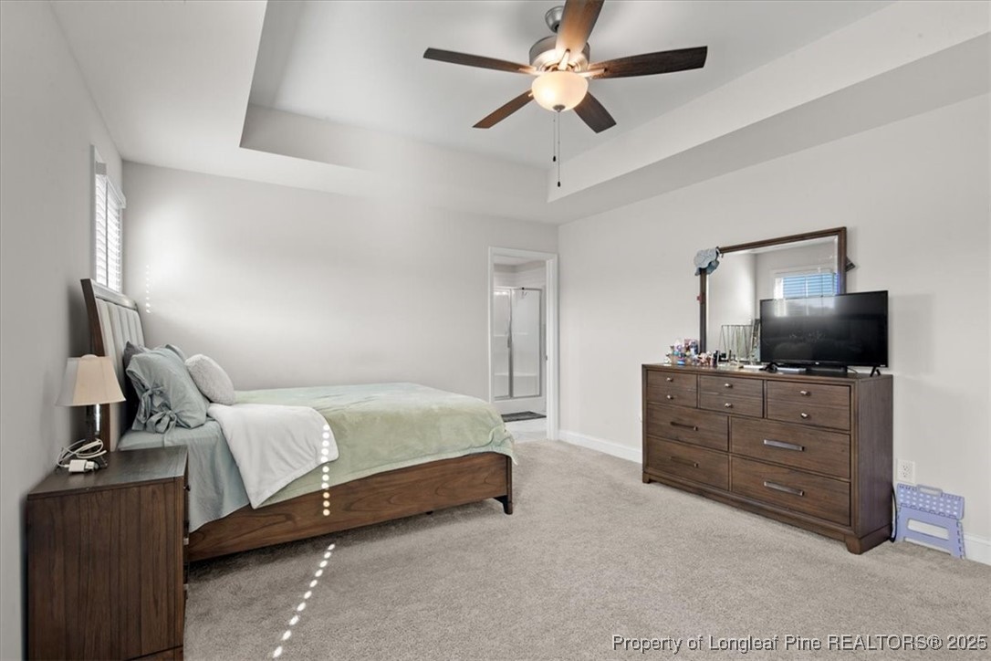 7840 Rufus Johnson Road Fayetteville, NC 28306 - Photo 42 of 50 a bedroom with a bed and a flat screen tv