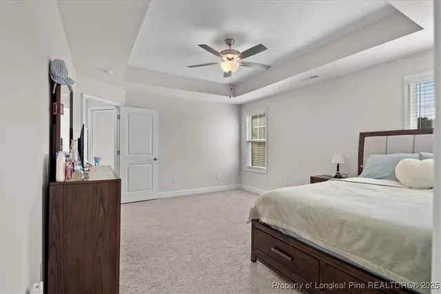 a spacious bathroom with a double vanity sink a mirror and a shower