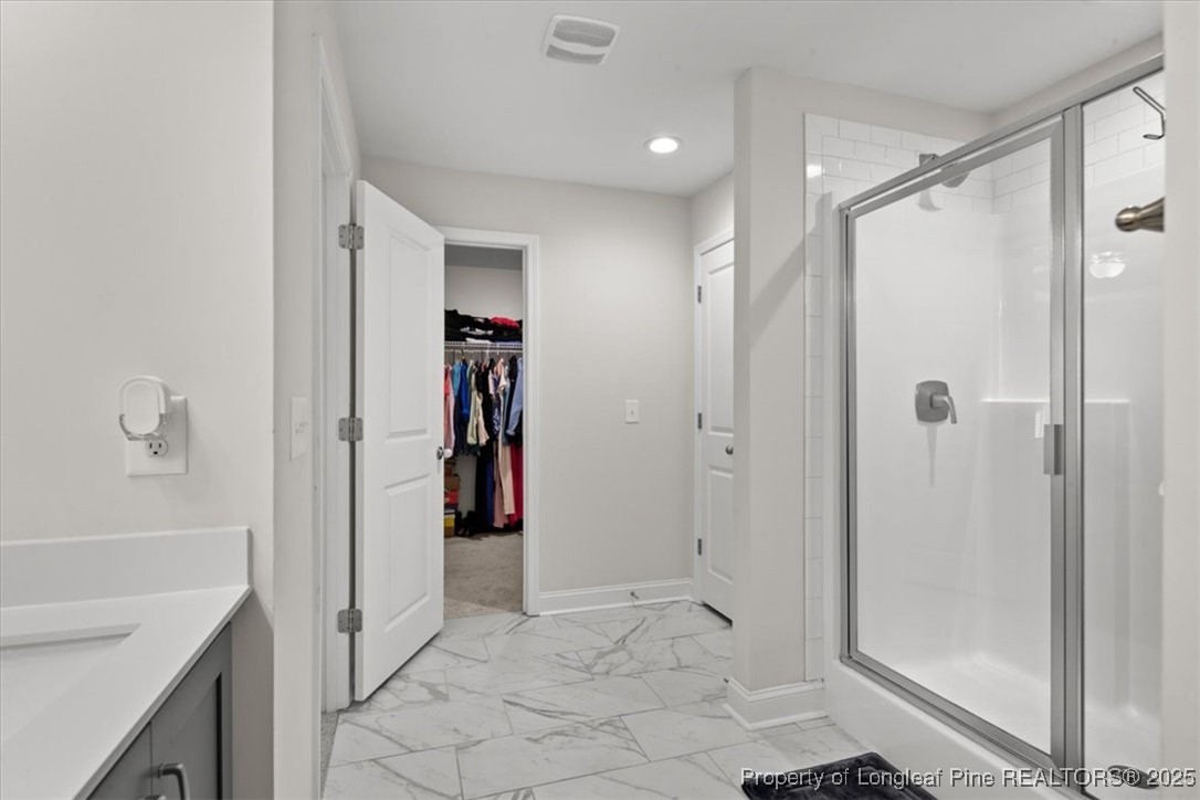 7840 Rufus Johnson Road Fayetteville, NC 28306 - Photo 47 of 50 a bathroom with a shower and a sink