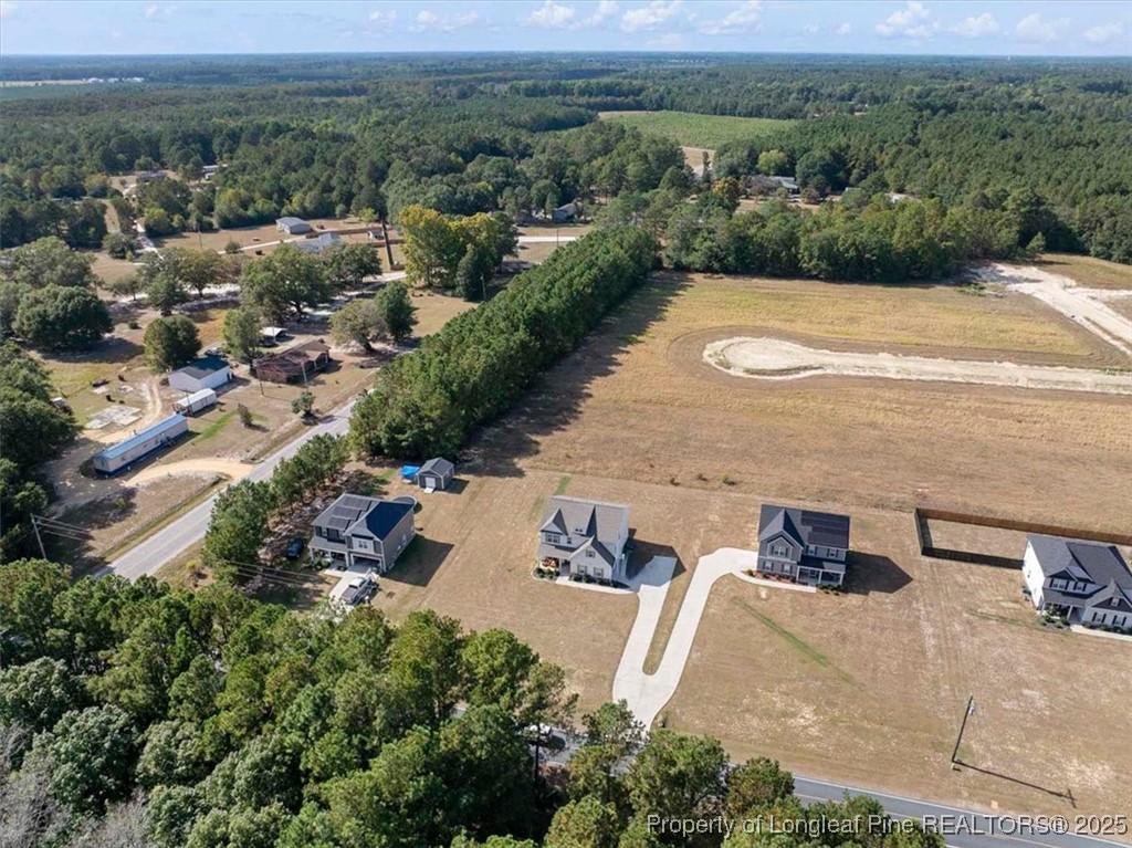7840 Rufus Johnson Road Fayetteville, NC 28306 - Photo 6 of 50 an aerial view of a house with a yard