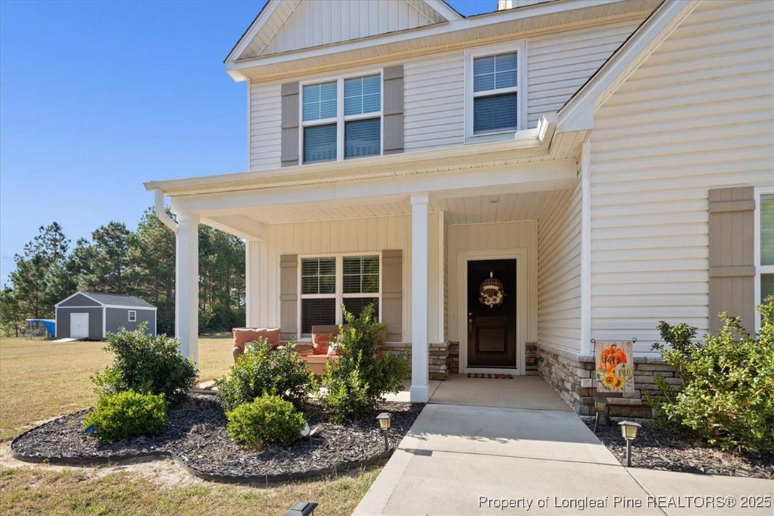 7840 Rufus Johnson Road Fayetteville, NC 28306 - Photo 7 of 50 a front view of a house with garden