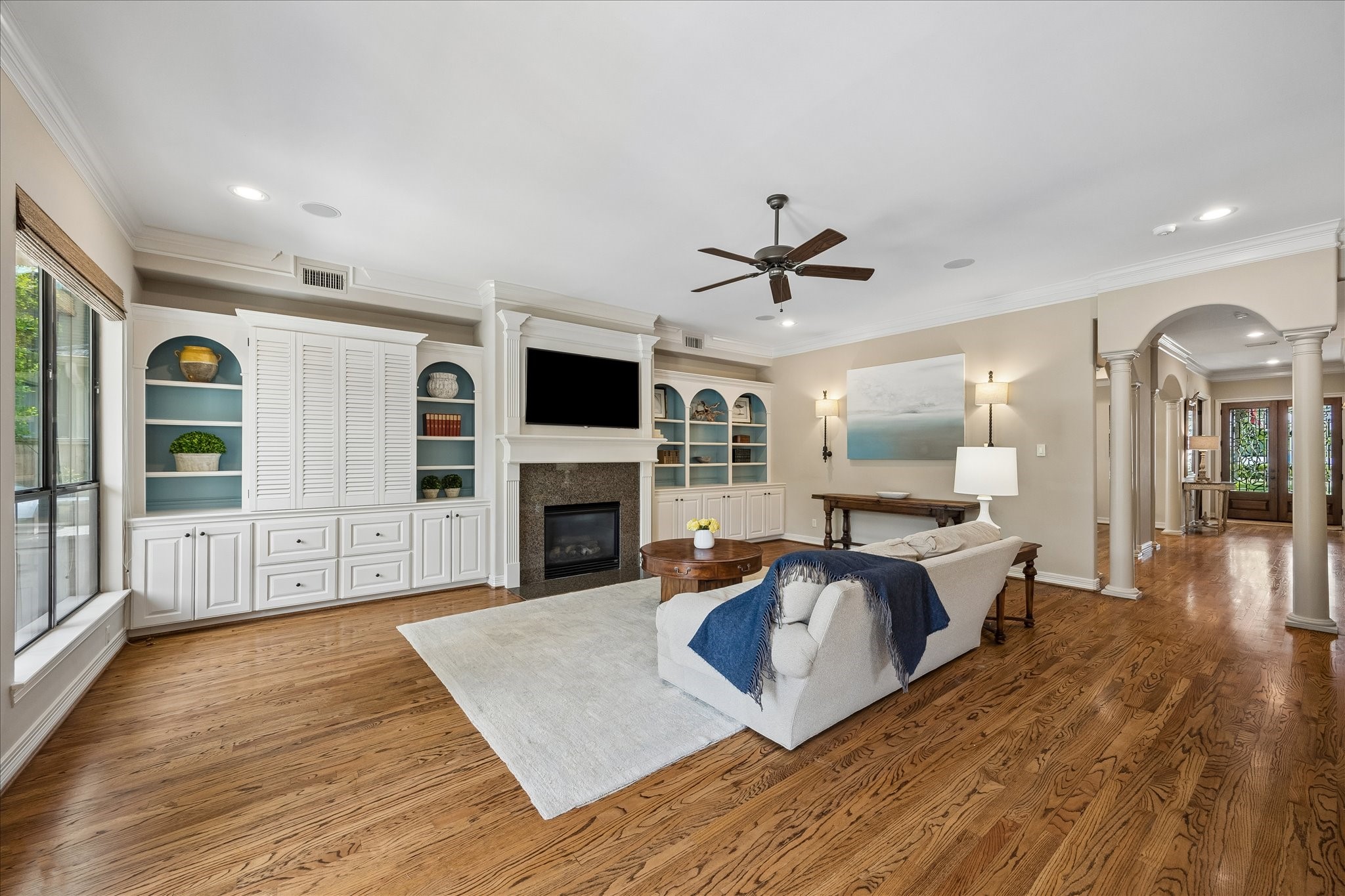 802 Anderson Street Bellaire, TX 77401 - Photo 10 of 36 The family room downstairs is quite large and offers built-ins and hidden wine storage.