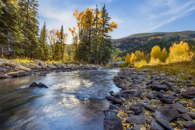 a view of a lake with a yard