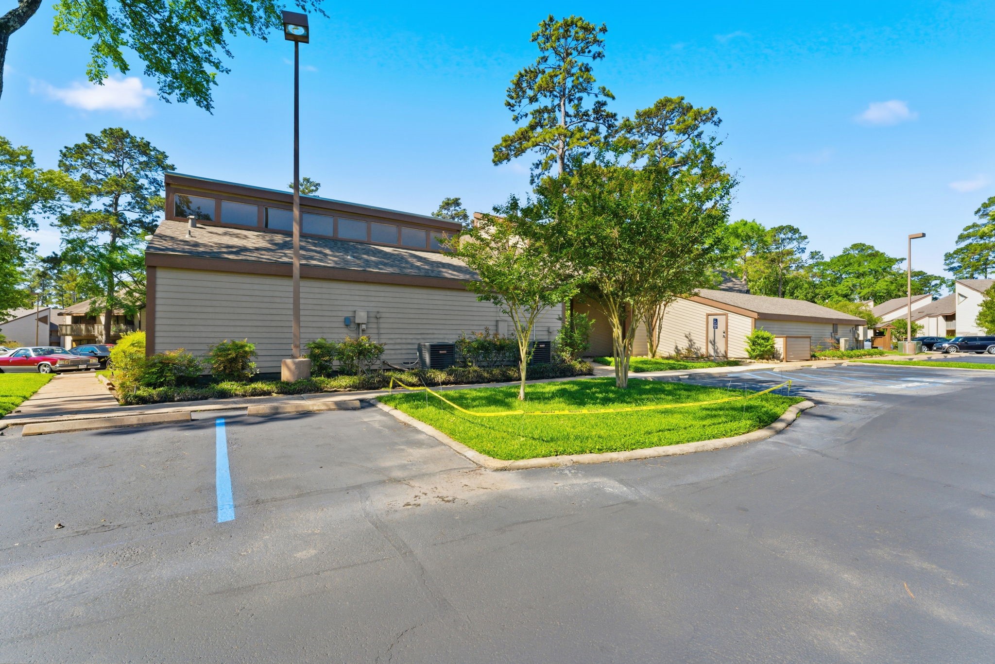 12900 Walden Road, Unit 219B Montgomery, TX 77356 - Photo 21 of 41 Club house and laundry area next to swimming pool.