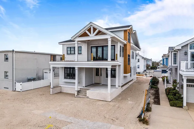 an aerial view of a house with a city view