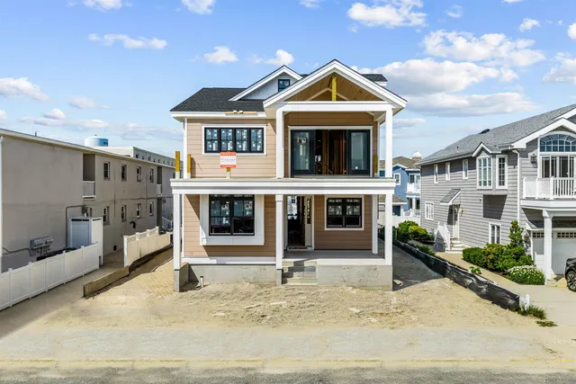 an aerial view of a house with large trees