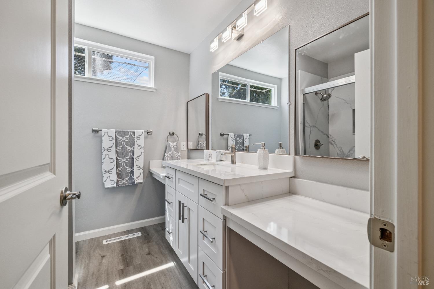 120 Oak Island Circle Santa Rosa, CA 95409 - Photo 18 of 28 a bathroom with a granite countertop sink a mirror and a bathtub
