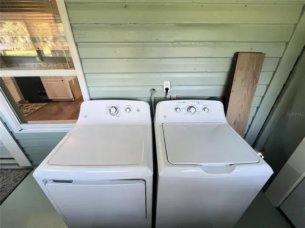 a utility room with dryer and washer