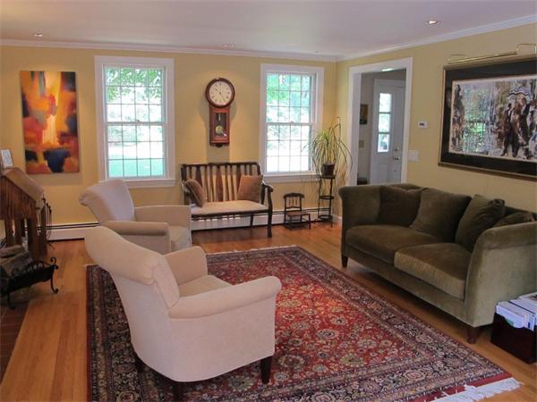 39 Highland Road Boxford, MA 01921 - Photo 11 of 30 a living room with furniture and a large window