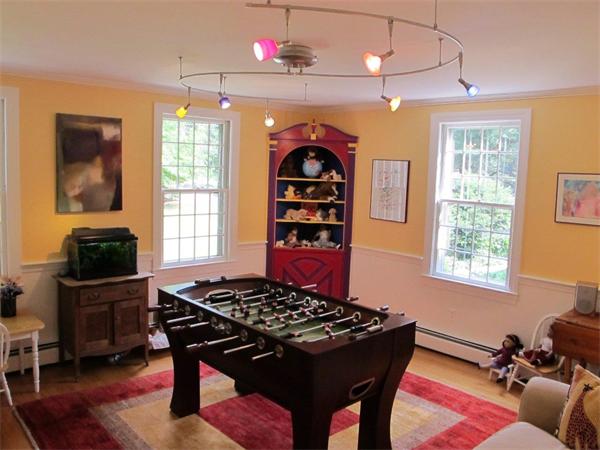 39 Highland Road Boxford, MA 01921 - Photo 13 of 30 a living room with a piano a rug and a window