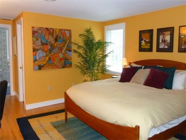 39 Highland Road Boxford, MA 01921 - Photo 19 of 30 a bed sitting in a bedroom next to a window
