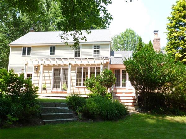 39 Highland Road Boxford, MA 01921 - Photo 23 of 30 a front view of a house with a garden