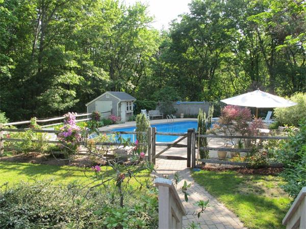 39 Highland Road Boxford, MA 01921 - Photo 25 of 30 a backyard of a house with table and chairs