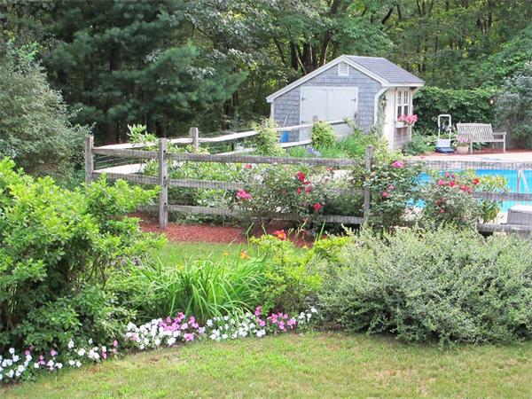 39 Highland Road Boxford, MA 01921 - Photo 29 of 30 a front view of a house with a yard and fountain in middle