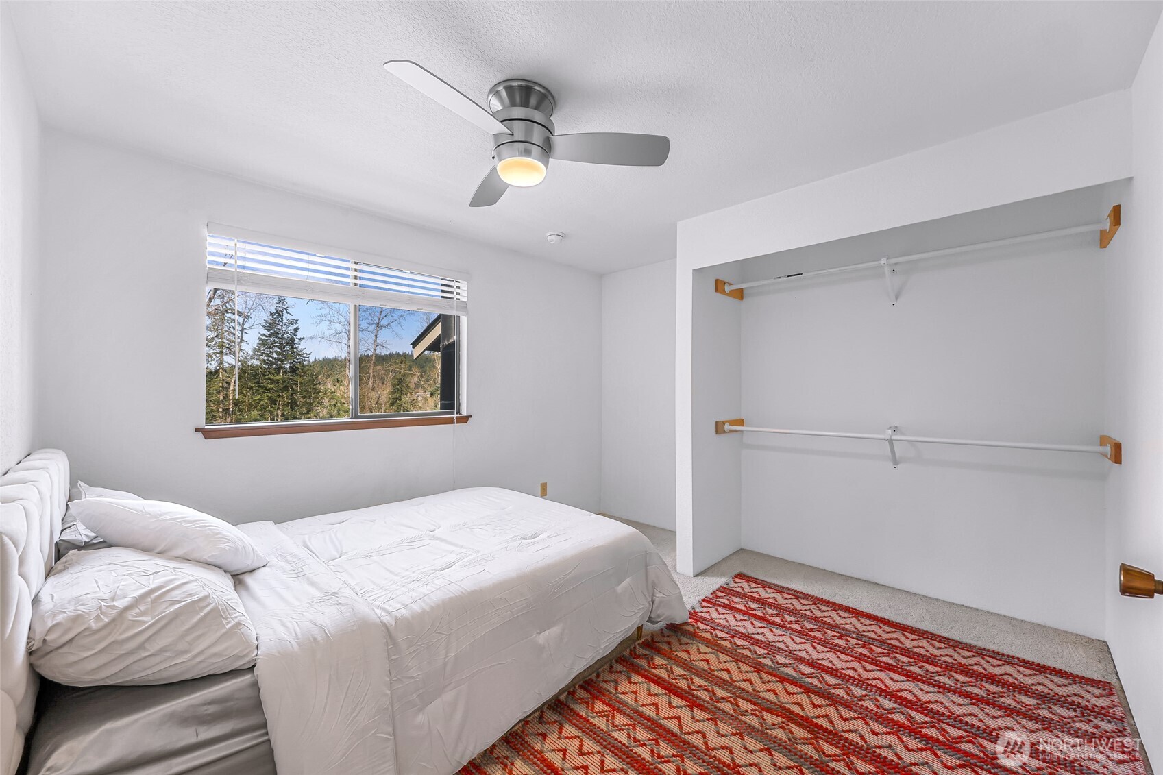 3500 Ridgemont Way, Unit 3 Bellingham, WA 98229 - Photo 19 of 39 a bedroom with a bed and a painting on the wall