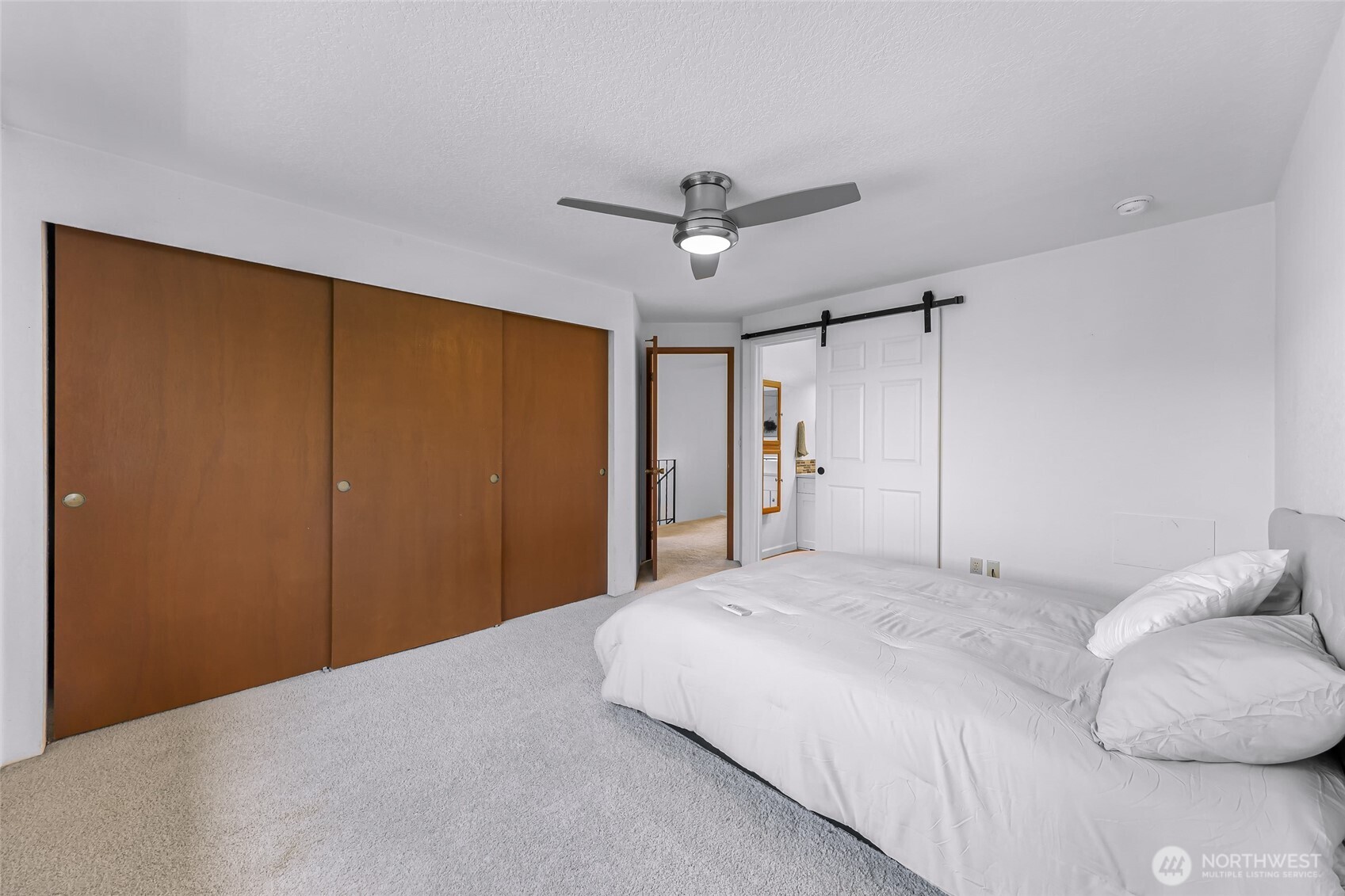 3500 Ridgemont Way, Unit 3 Bellingham, WA 98229 - Photo 24 of 39 a bedroom with a bed and a chandelier