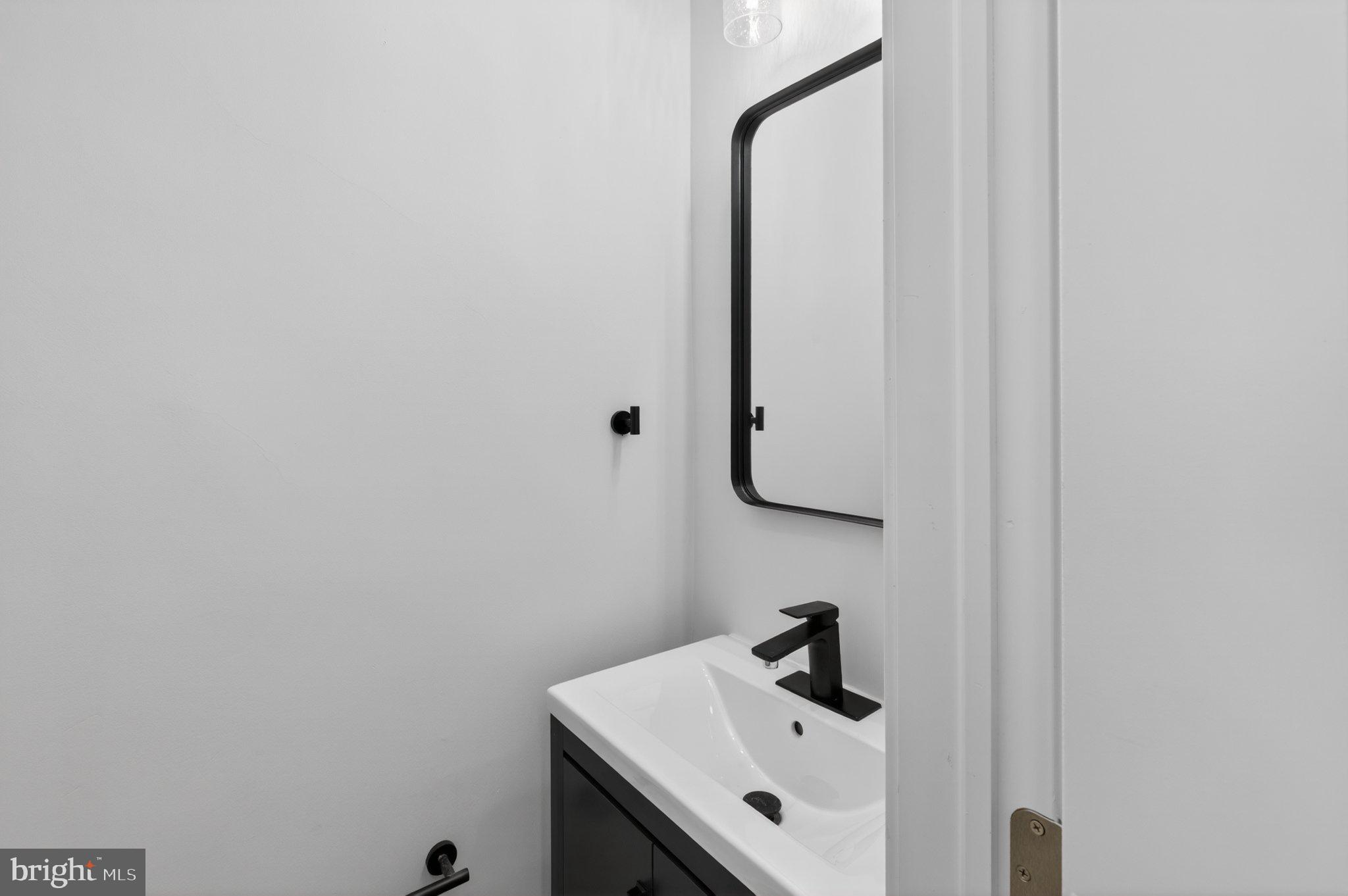 2015 Gales Street Northeast Washington, DC 20002 - Photo 10 of 10 a bathroom with a sink and a mirror