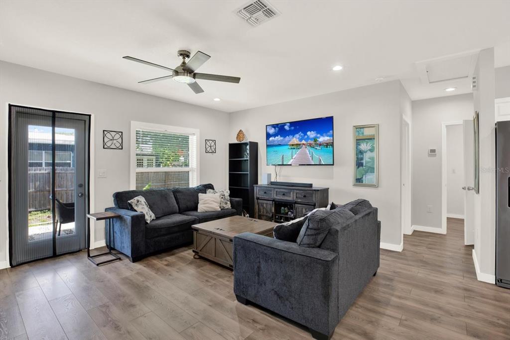 3023 Muir Street Holiday, FL 34691 - Photo 9 of 25 a living room with furniture and a flat screen tv