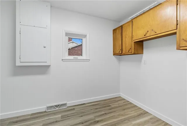 a view of small space with wooden floor