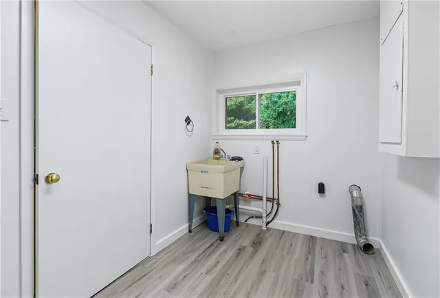 a view of a workspace with furniture and windows