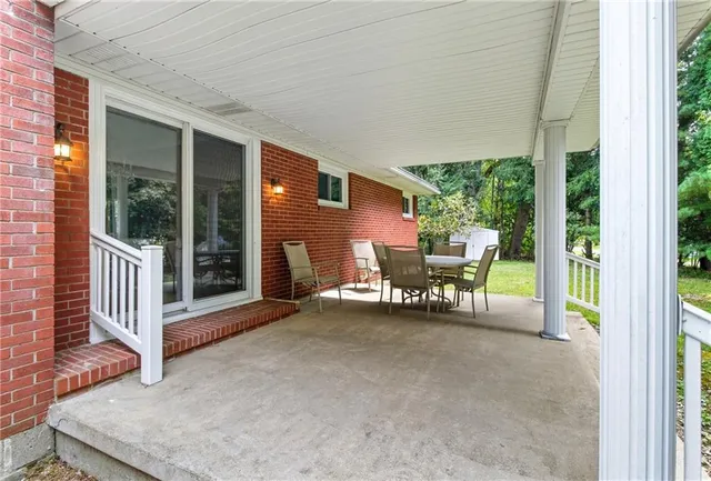 a view of two chairs in the balcony