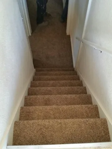 a bathroom with a sink and mirror with toilet