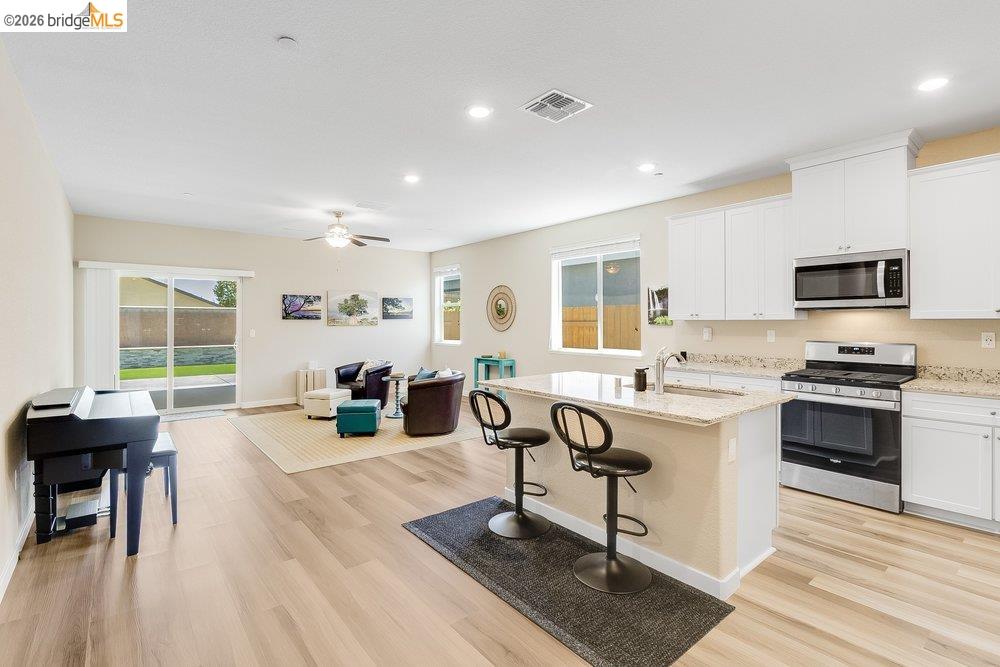 4347 Canada Way Rio Vista, CA 94571 - Photo 10 of 41 Spacious open-concept living area featuring wood-finish flooring, recessed lighting, and a ceiling fan