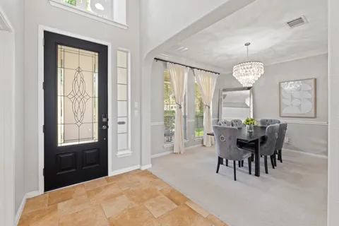 a view of a dining room with furniture window and outside view