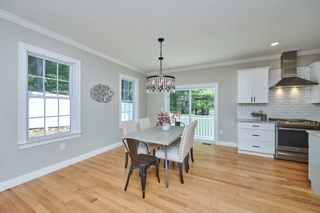 60 Peach Orchard Road Burlington, MA 01803 - Photo 11 of 42 a view of a dining room with furniture window and wooden floor