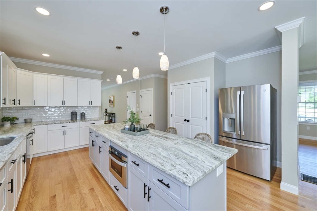 60 Peach Orchard Road Burlington, MA 01803 - Photo 16 of 42 a kitchen with a sink and refrigerator