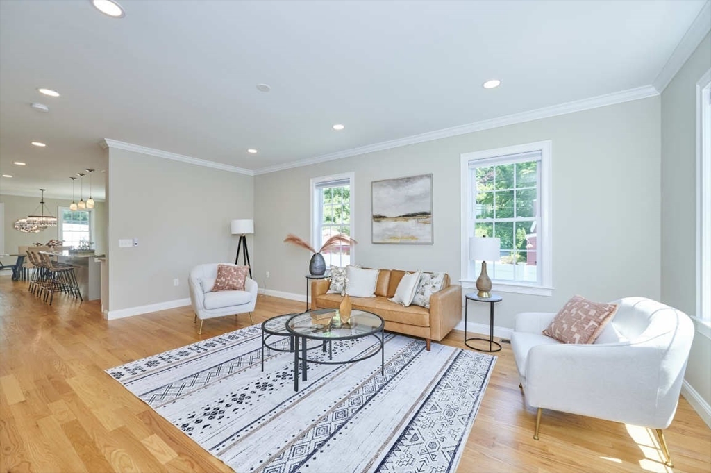 60 Peach Orchard Road Burlington, MA 01803 - Photo 18 of 42 a living room with furniture and a table