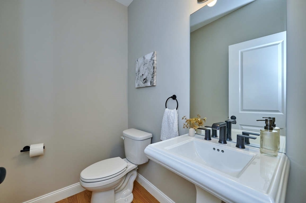 60 Peach Orchard Road Burlington, MA 01803 - Photo 19 of 42 a bathroom with a sink a toilet and a mirror