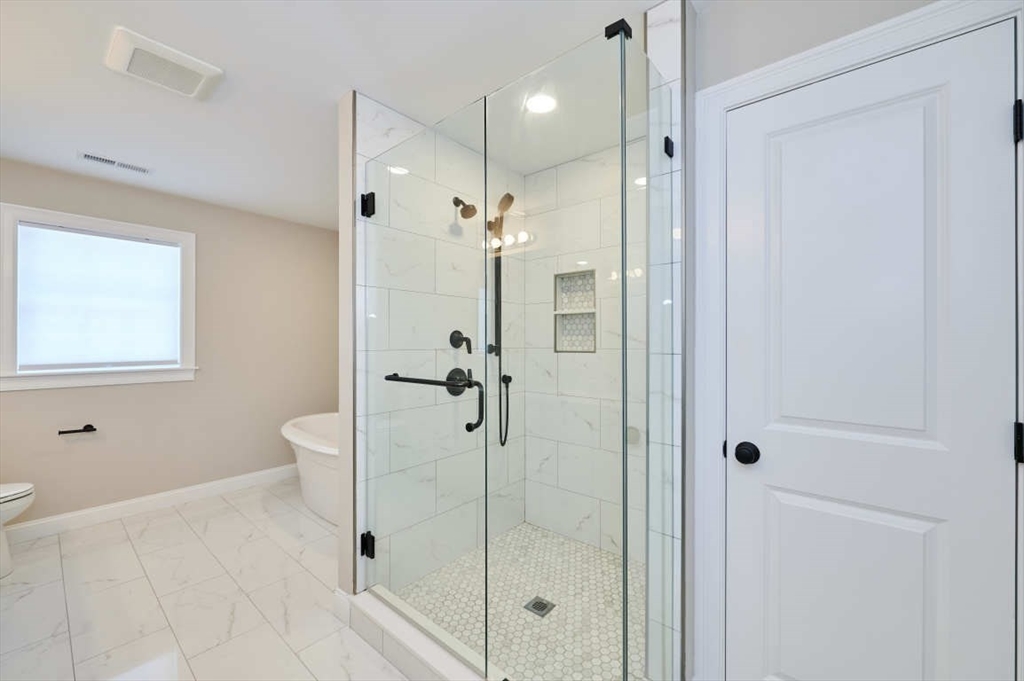 60 Peach Orchard Road Burlington, MA 01803 - Photo 29 of 42 a bathroom with a shower and a toilet