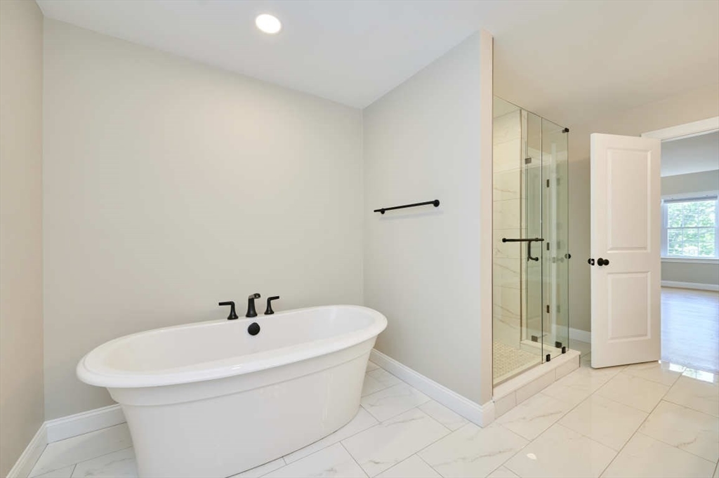 60 Peach Orchard Road Burlington, MA 01803 - Photo 30 of 42 a white bath tub sitting next to a bathroom sink