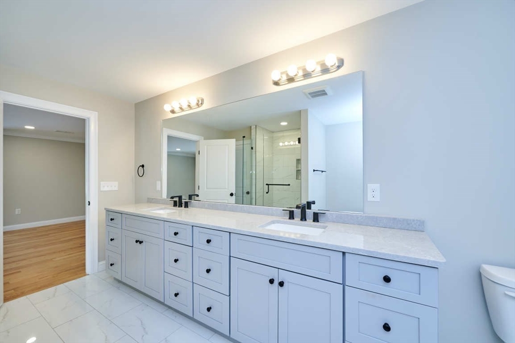 60 Peach Orchard Road Burlington, MA 01803 - Photo 31 of 42 a bathroom with a double vanity sink mirror and