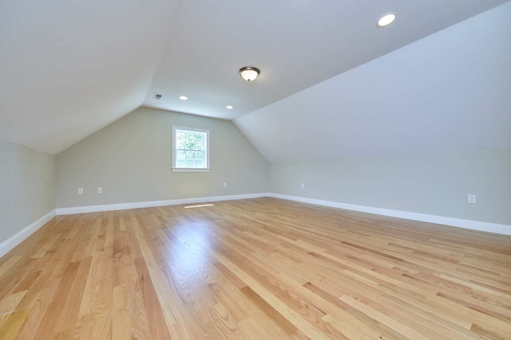 60 Peach Orchard Road Burlington, MA 01803 - Photo 35 of 42 wooden floor in an empty room with a window