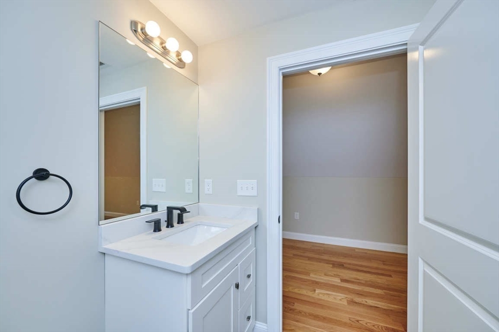 60 Peach Orchard Road Burlington, MA 01803 - Photo 40 of 42 a bathroom with a sink and a mirror