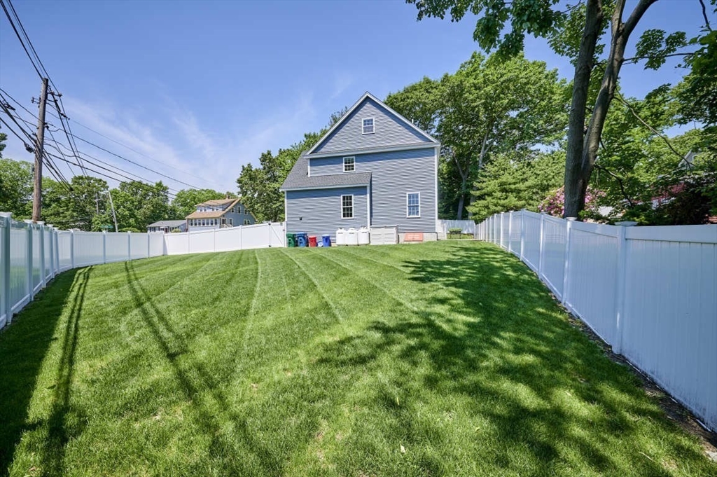 60 Peach Orchard Road Burlington, MA 01803 - Photo 6 of 42 a view of a house with a yard and plants
