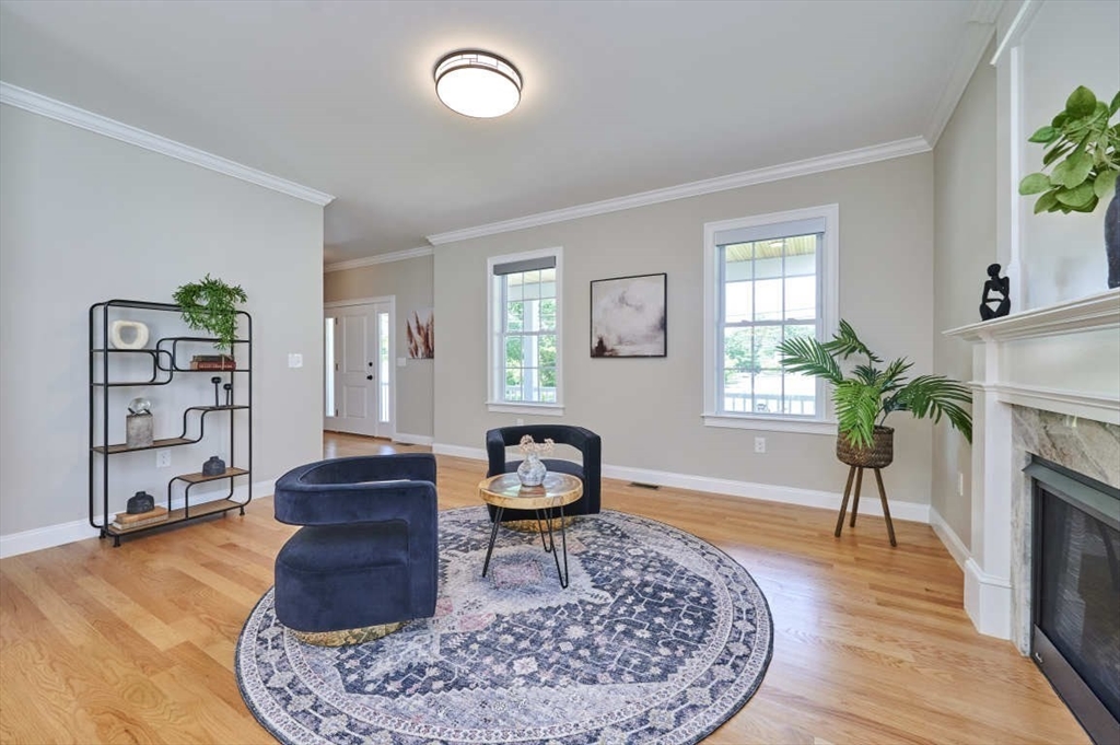 60 Peach Orchard Road Burlington, MA 01803 - Photo 8 of 42 a living room with furniture a window and a fireplace