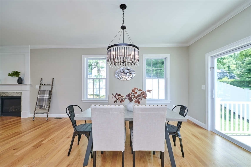 60 Peach Orchard Road Burlington, MA 01803 - Photo 10 of 42 a view of a dining room with furniture window and wooden floor