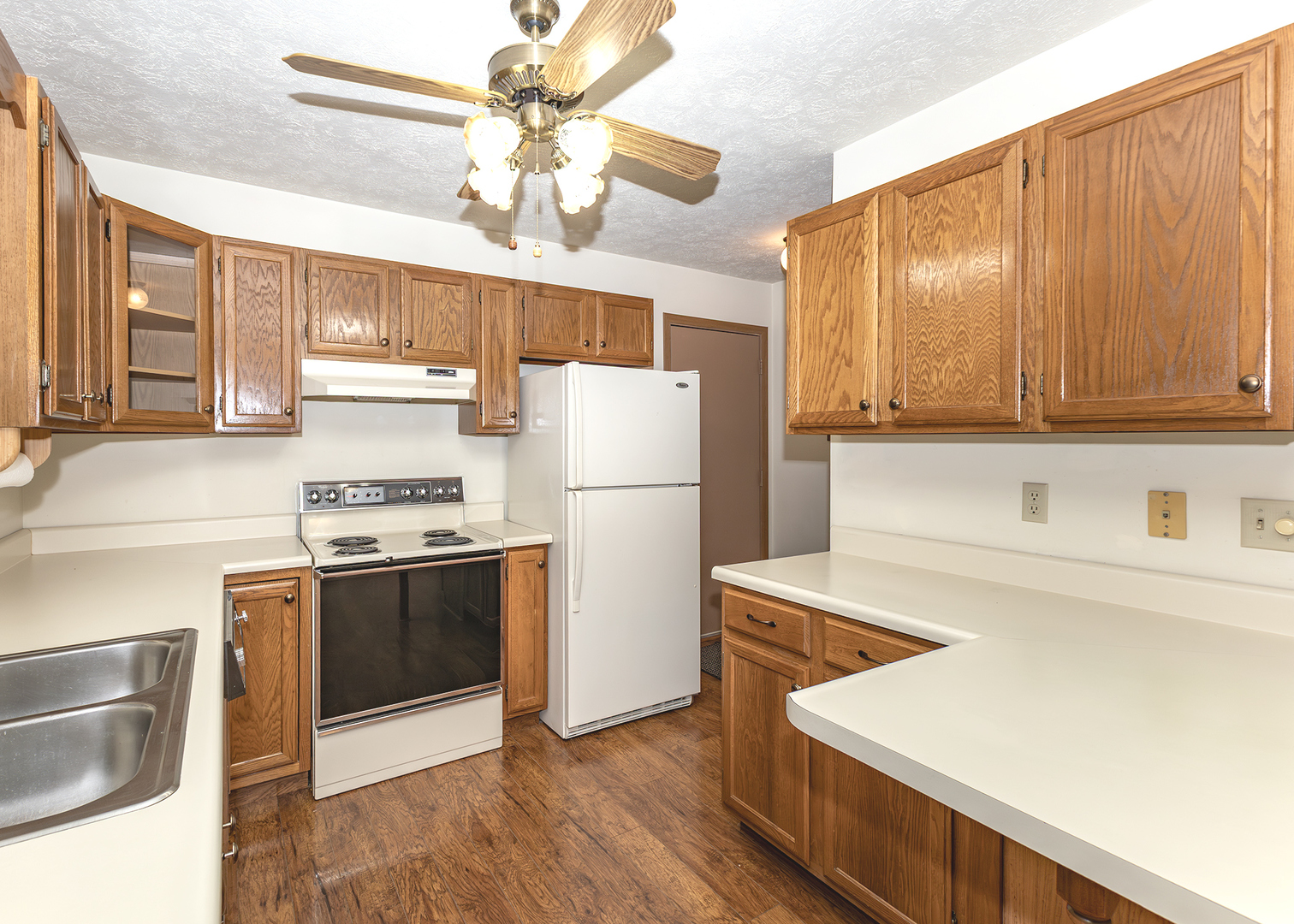 4237 26th Avenue, Unit 1 Moline, IL 61265 - Photo 8 of 18 a kitchen with stainless steel appliances granite countertop a refrigerator a stove a sink dishwasher and a refrigerator with wooden floor