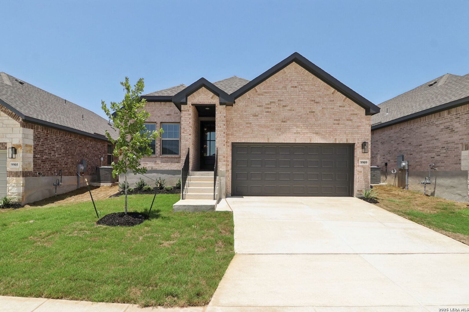 9909 Paladin Ridge San Antonio, TX 78254 - Photo 1 of 41 a front view of a house with garden