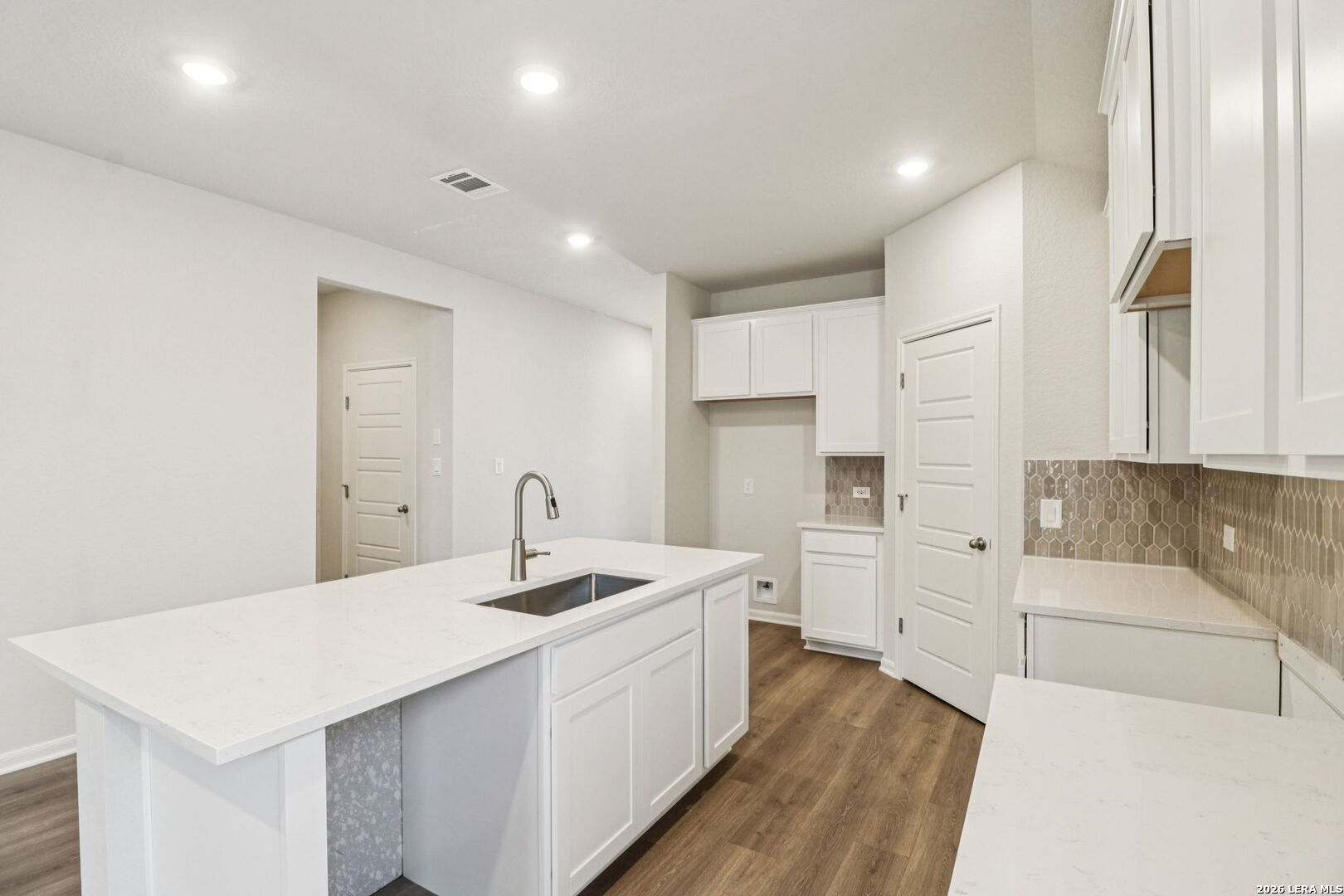 9909 Paladin Ridge San Antonio, TX 78254 - Photo 12 of 41 a kitchen that has a sink and a stove in it