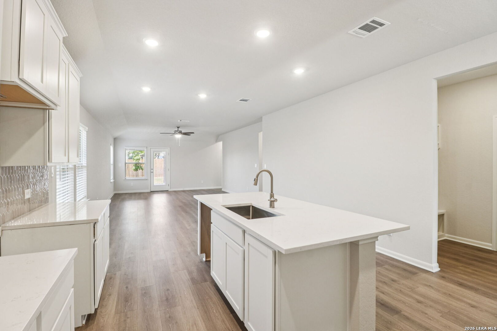 9909 Paladin Ridge San Antonio, TX 78254 - Photo 15 of 41 a kitchen with a sink and wooden floor
