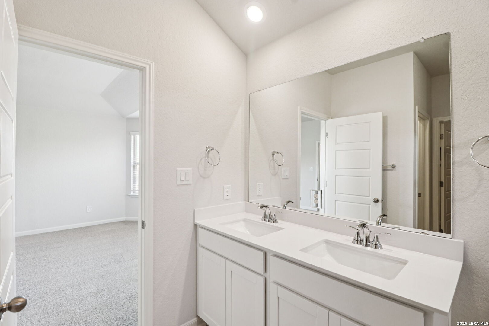 9909 Paladin Ridge San Antonio, TX 78254 - Photo 24 of 41 a bathroom with 2 sink and a mirror